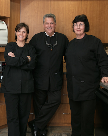 Your Shelby Township dental team smiling in their office